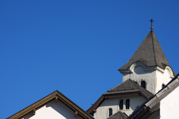 Fototapeta na wymiar Roofs of Church on Blue Sky