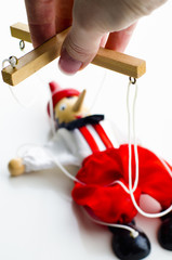 doll puppet in the hands of