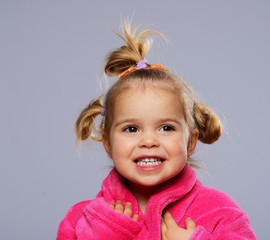 Funny little girl in dressing gown