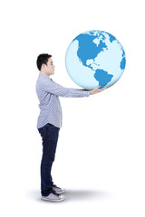Asian man with a globe