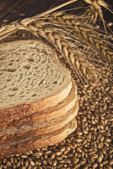 Bread slices, wheat ears and grains