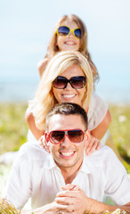 happy family with blue sky and green grass