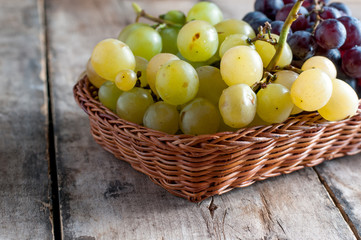 Grapes on a old wooden table