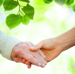 Holding hands with senior