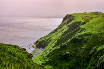 Ocean coastline with green cliffs in Scottish highlands