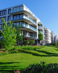Apartment houses and green grass