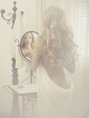 Seductive woman in the mirror