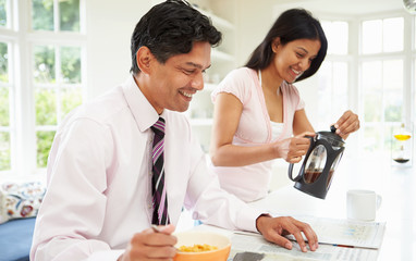 Man Having Breakfast Before Going To Work