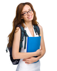 Young student girl is holding book