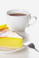 Cake and tea on white b