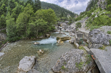 Waterfalls on a mountain landscape. Summer season