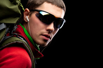 young man with backpack walking