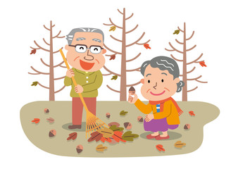 落葉掃除をする老夫婦