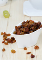 Raisins in a small white bowl