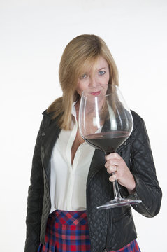 Woman sampling a very large glass of red wine