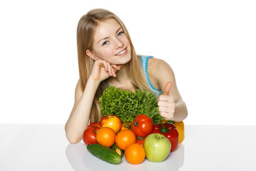 Girl with vegetables and fruits showing thumb up