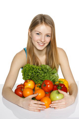 Girl embracing vegetables and fruits