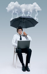 Businessman having problems with cloud computing technology