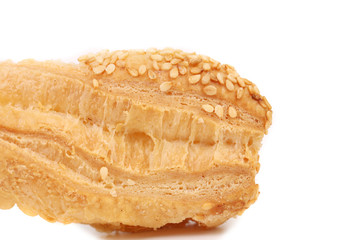 Piece of crunchy puff pastry with sesame.