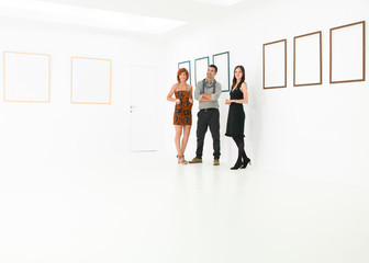 group of tourists in art gallery