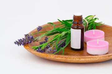 Aromatherapy Lavender oil and lavender flower in the wooden bowl