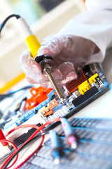soldering electronic parts on a printed circuit board