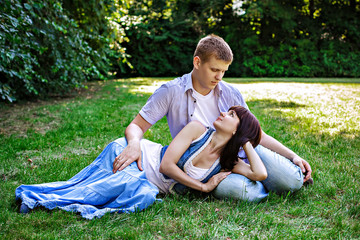 Fototapeta premium Romantic young couple relaxing in park