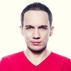 Fototapeta premium Portrait of a fashionable male model in pink t-shirt smiling