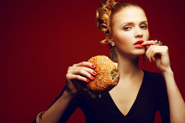 Unhealthy eating. Junk food concept. Girl eating burger