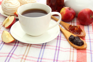 light breakfast with tea and homemade jam, on tablecloth
