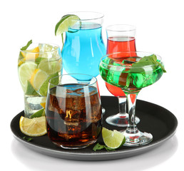 Many glasses of cocktails on tray, isolated on white