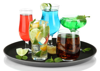 Many glasses of cocktails on tray, isolated on white