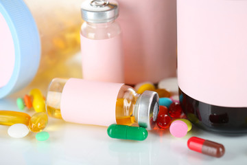 Pills and medicine bottles isolated on white