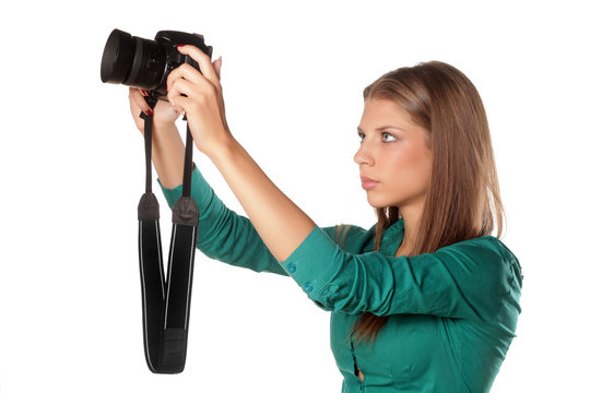 young girl photographing with her camera using LiveView