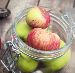 little apples in a glass jar
