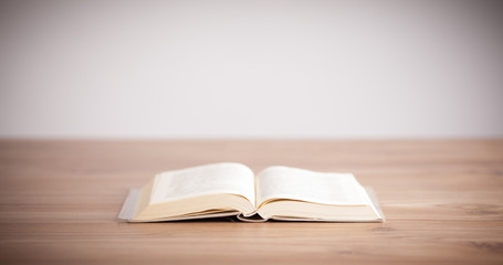 Open book on wooden deck