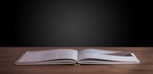 Open book on wooden deck
