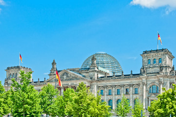 German Parliament with national flag in Berlin