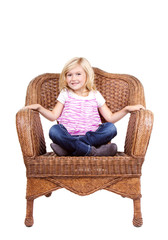 little girl sitting on a chair