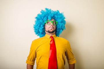 crazy funny young man with blue wig - obrazy, fototapety, plakaty