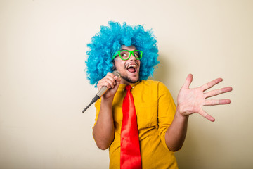 crazy funny young man with blue wig