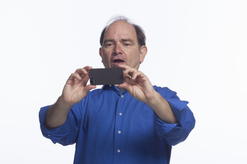 Man directing and taking picture with smartphone, horizontal