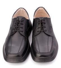 Black glossy man’s shoes with shoelaces