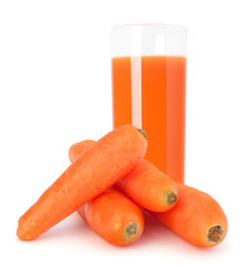 Carrot juice glass and carrot tubers