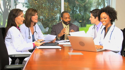 Medical Executive Boardroom Meeting with Financial Advisors