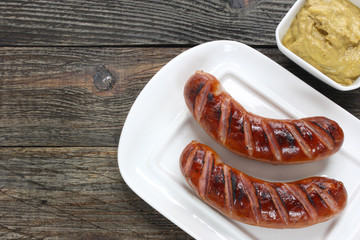 Grilled sausages on white plate
