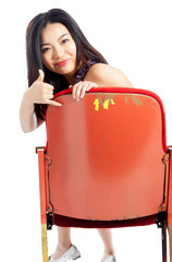 Attractive Asian girl 20s at the theatre isolate white backgroun
