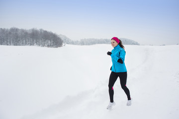 Fototapeta na wymiar Woman running in winter