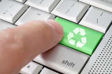 Business concept male finger pressing Recycle key