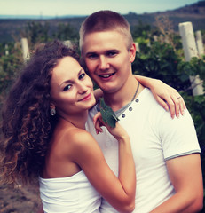 happy young couple kissing and hugging   